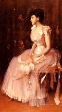 Retrato de una dama vestida de rosa William Merritt Chase Pinturas al óleo